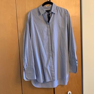 Navy and white striped collared shirt.